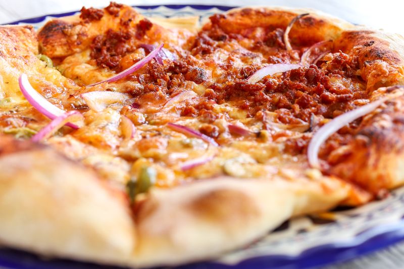 Mod Pizza BBQ chicken pizza with red onion